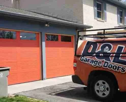 New orange louvered garage door installed