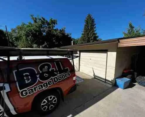 Old garage door at job site before installation