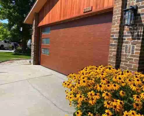 Mahogany flush woodgrain garage door installed