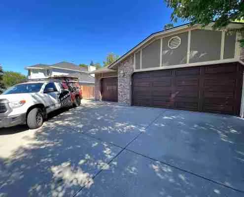 Beautiful walnut wood grain garage doors installed