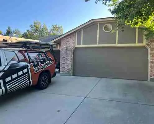 Old tan garage doors before installation